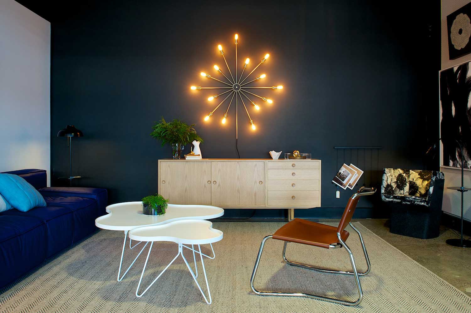 Fred International Sydney Showroom by Yellowtrace | Photo © Nick Hughes. Fred International Sydney Showroom by Yellowtrace, Astoria 15 arm wall light from Ruben Lighting, Karl Anderson & Söner Øresund sideboard, Swedese White Flower Mono coffee tables, Mitab We Get Along chair in brown leather, Armadillo & Co Herringbone Weave rug.
