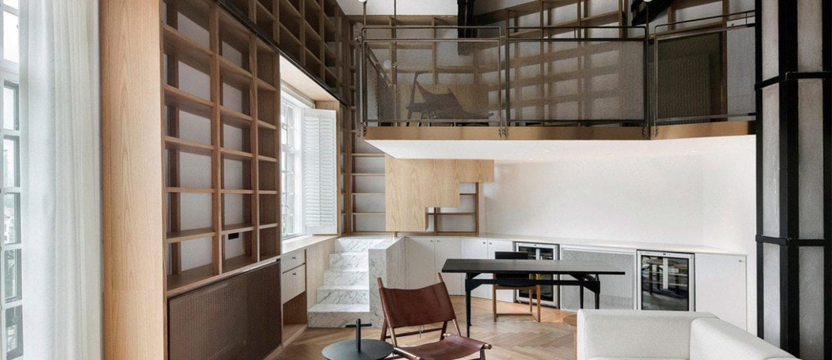 Shanghai Apartment Lined With Floor To Ceiling Bookshelves